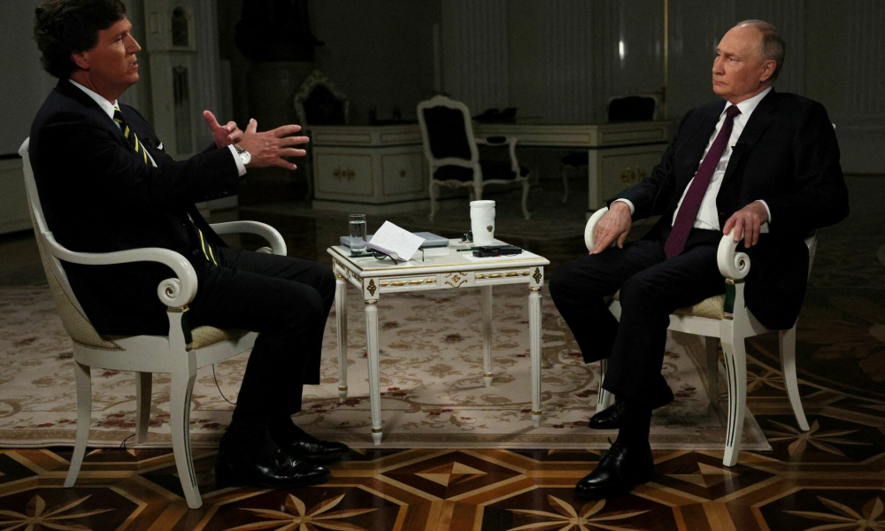 Russian President Vladimir Putin listens during an interview with U.S. television host Tucker Carlson in Moscow, Russia February 6, 2024. Sputnik/Gavriil Grigorov/Kremlin via REUTERS ATTENTION EDITORS - THIS IMAGE WAS PROVIDED BY A THIRD PARTY.